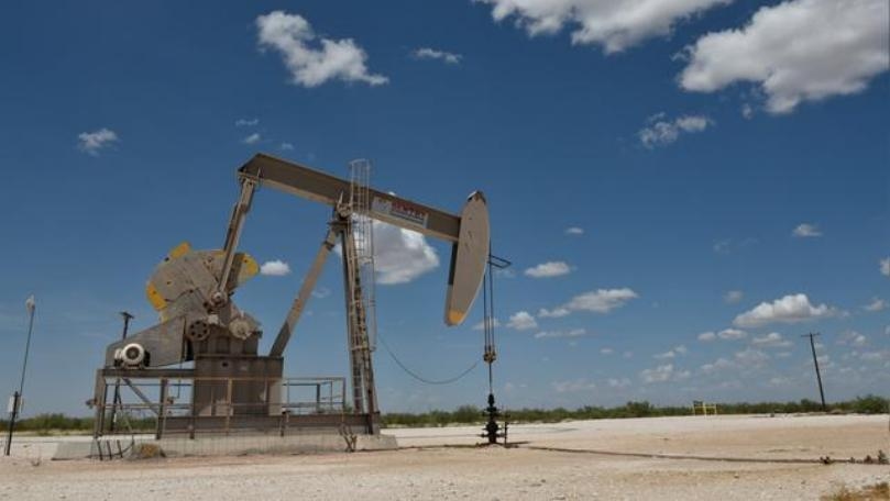 Oil drops below $65 on Fed outlook, ample supply