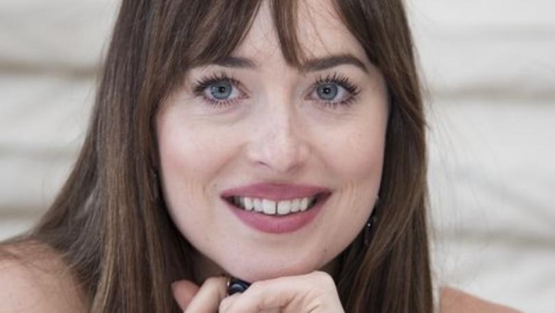 Dakota Johnson Explains Mystery Behind Missing Tooth Gap