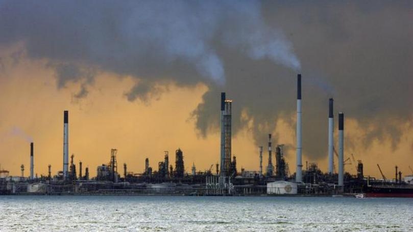 Oil prices slip as demand concerns outweigh efforts to curb supply