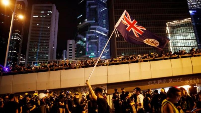Hong Kong protesters throng streets peacefully in heavy rain