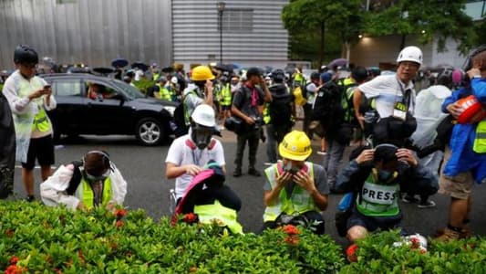Hong Kong police again use tear gas to try to disperse protesters