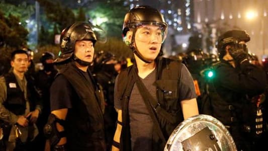 Hong Kong police arrest 29 after clashes as protesters regroup in the rain