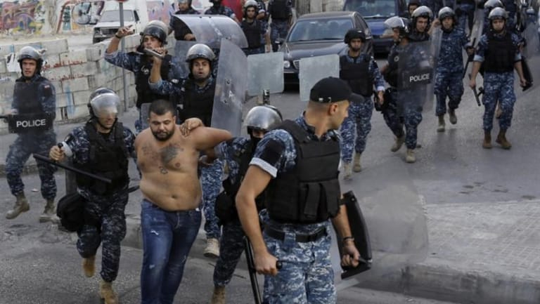 من أحرق صورة رفيق الحريري؟