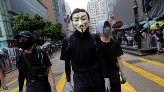 Thousands defy anti-mask law and march in Hong Kong