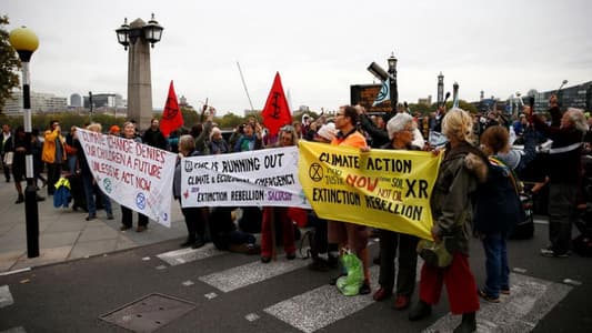 London police arrest 21 climate change protesters as mass action starts