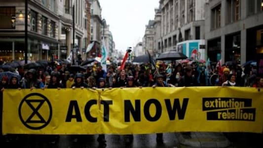 Climate change activists target London's financial district