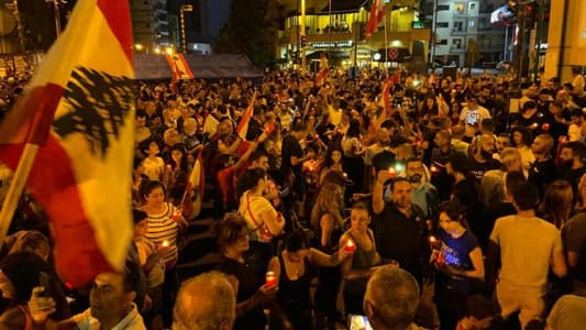 Photo: Protesters light candles in Sassine Square in Ashrafieh