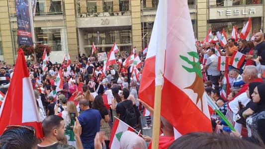 Scores of Lebanese join in a demonstration in Sydney in support of their fellow Lebanese citizens