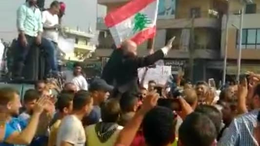 Photo: Protesters in Abdeh Square celebrate a groom as his wedding procession was passing in the region