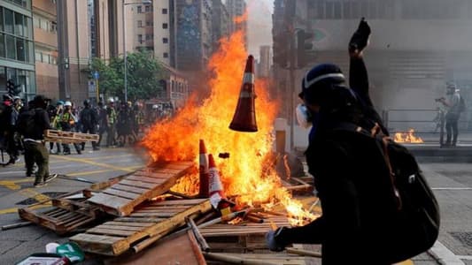 Hong Kong leader to visit Japan after huge rally, night of violence