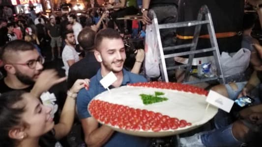 Photo: Restaurant offers a large bowl of hummus to protesters