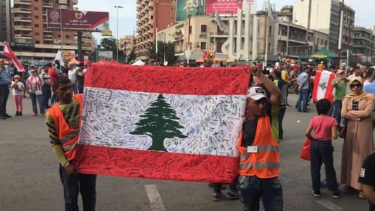 Lebanese flag bearing protesters signatures dispatched from Kfarhazir to Tripoli