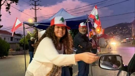 Protesters distribute leaflets with their demands along Kfar Aqa highway