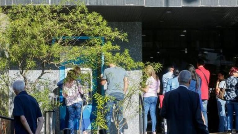 Banks re-open for first time in two weeks