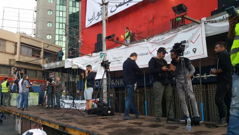 Protesters head towards Abdul Hamid Karami Square