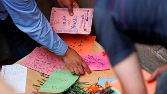 Slain in Mexico, seven-month-old twins buried in rain-swept funeral