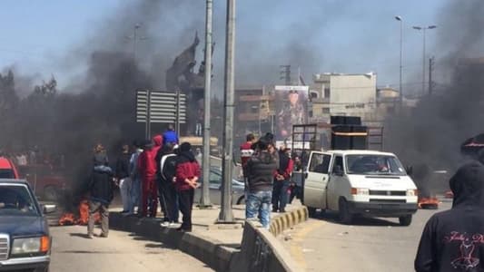 Protestors block roads across Lebanon as part of general strike