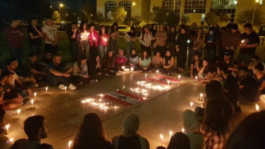 Photo: Candles being lit at the Lebanese University in Hadath