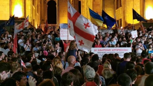 Riot police in Georgia detain protesters demanding early election