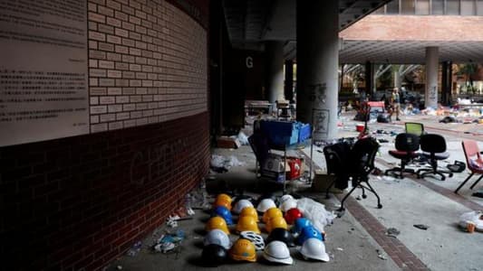 Protesters stay holed up on Hong Kong campus, surrounded by riot police