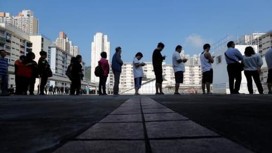 Record numbers vote in Hong Kong amid angry calls for democracy