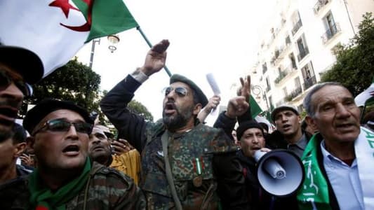 Pro-government supporters rally in Algeria to back planned elections