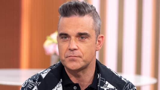 Robbie Williams Says His Seven-Year-Old Daughter Is a Better Singer Than Him
