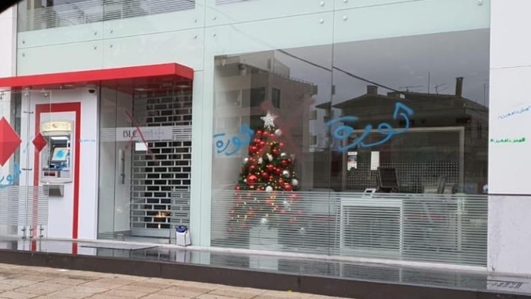 Protesters throw eggs at bank branch in Bikfaya