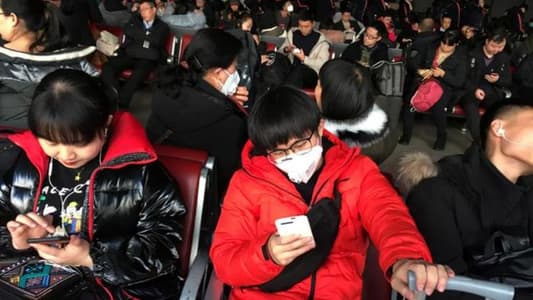 As virus spreads to more Chinese cities, WHO calls emergency meeting