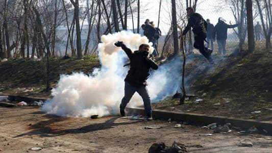 Greek police fire teargas on migrants at border with Turkey 