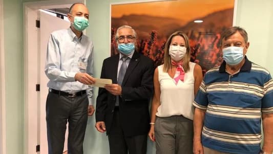 مساهمة مالية لمستشفى حمود وجمعية المقاصد في مواجهة "كورونا"