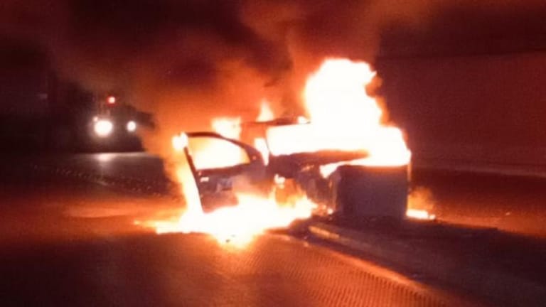 Photo: Car catches fire after crashing into tunnel wall