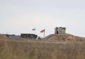 Russia says Karabakh Armenian fighters start giving up arms