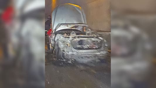 Photo: A car catches fire inside the airport tunnel on the lane that connects Khaldeh to the airport; the tunnel's two lanes are now closed as a result