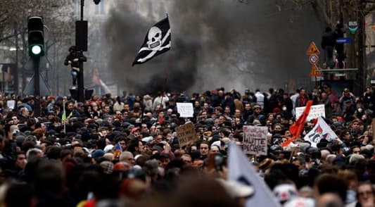 Violence hits Paris in day of protests over Macron's pension changes