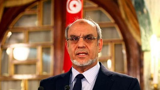 Tunisian police arrest ex-prime minister, his family says