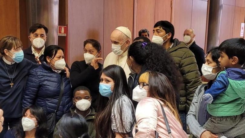 Pope makes surprise visit to homeless getting COVID-19 vaccine in Vatican