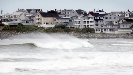 Storm Lee cuts power to tens of thousands as it brings fierce winds and coastal flooding to US and Canada