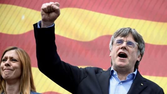 Puigdemont back in Spain despite arrest warrant