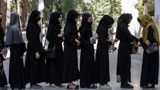 AFP: Afghan women banned from university 'for not following dress code', according to Taliban minister