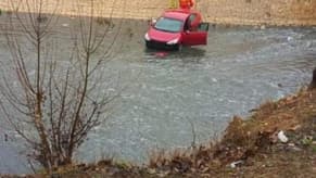 Photo: A car in the river