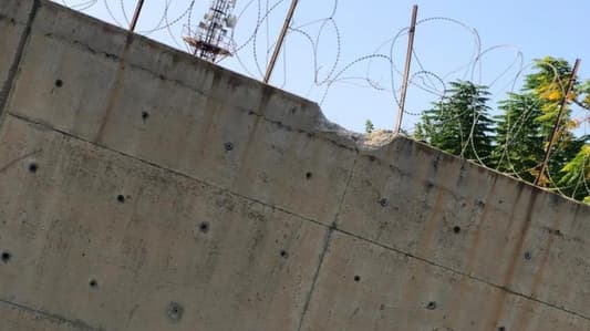 Photo: An Israeli shell hits the UNIFIL wall