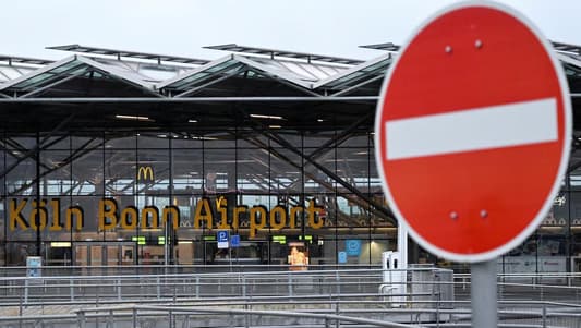 Climate activists disrupt air traffic at German airport; UK police arrest nine