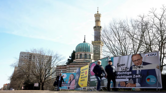 Germans start voting, polls suggest shift to right