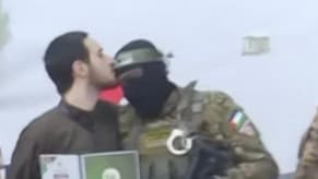 Watch: A Hostage Kisses an Al-Qassam Member's Head