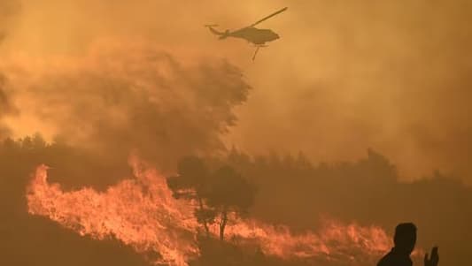 People flee wildfire near Athens as it spreads 'like lightning'