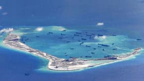 Philippines sends ships to disputed atoll amid China's island building