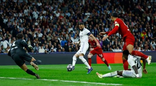 Soccer–Real Madrid ease past Liverpool into Champions League quarters