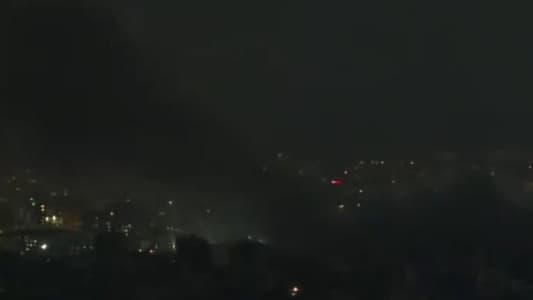 Photo: Columns of smoke rise from a building in Ghobeiry after the intense airstrike that targeted and destroyed it