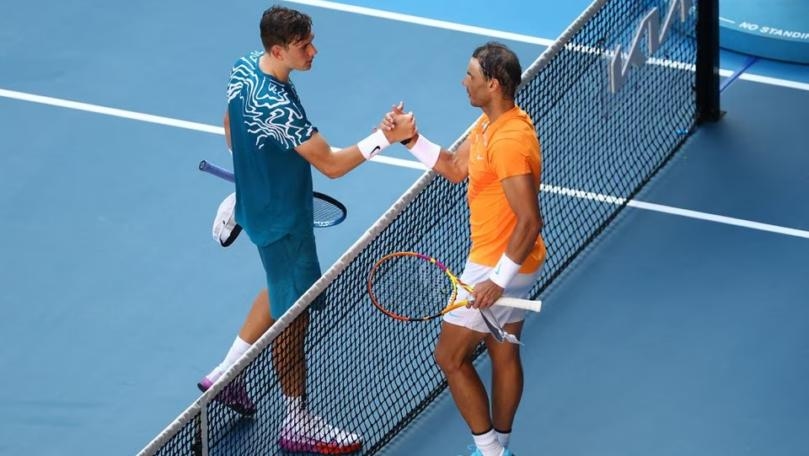 Nadal grinds down cramping Draper to reach second round